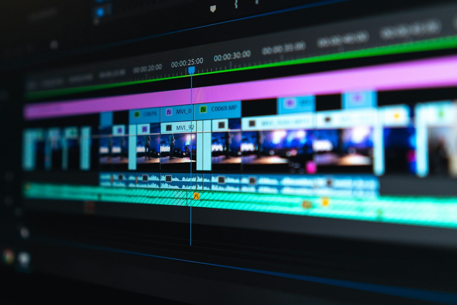 Close-up of a video editing timeline with wedding footage, video tracks and audio waveforms